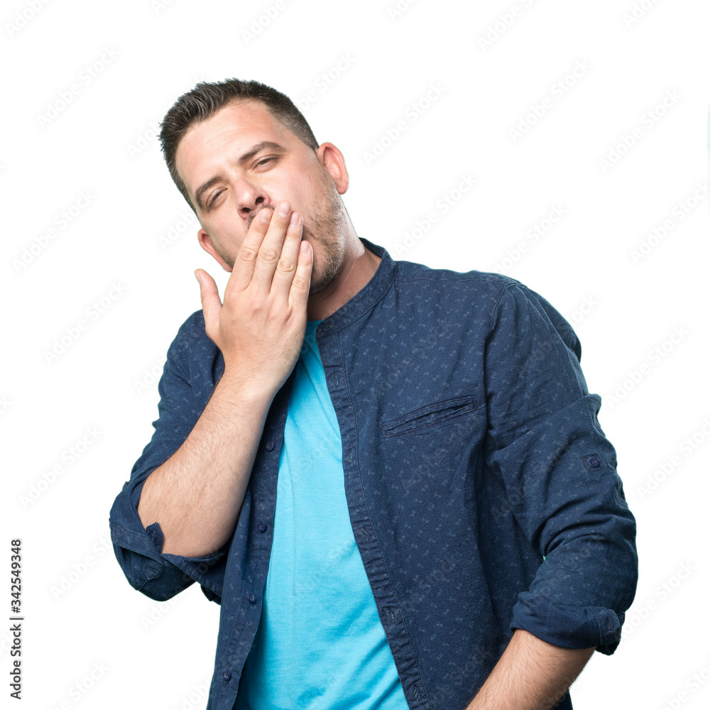 Young man wearing a blue outfit. Looking sleepy. Young man wearing a blue outfit. Looking sleepy.