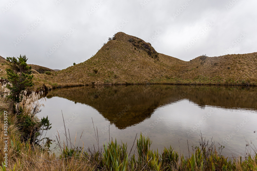 Small mountain reflected in a lagoon