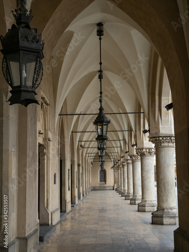 Empty arcades of Sukiennice on empty Krakow s Main Market Square during covid-19 coronavirus pandemic.