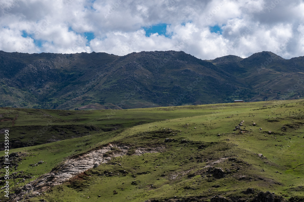 Andean mountain landscape with cloudy sky Cusco-Peru