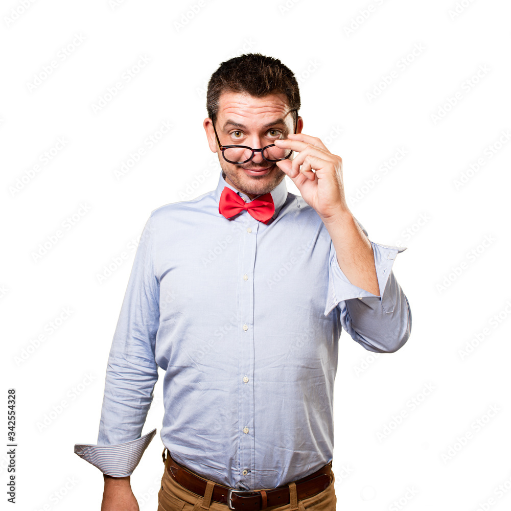 Man wearing a red bow tie. Looking over glasses. Man wearing a red bow tie. Looking over glasses.