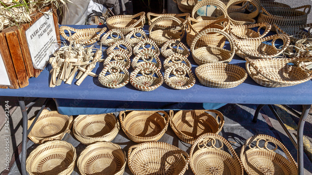 Sweetgrass Baskets,  beautiful handicrafts of African origin, on display at historic Charleston City Market in Charleston, South Carolina.