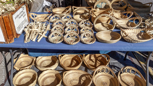 Sweetgrass Baskets, beautiful handicrafts of African origin, on display at historic Charleston City Market in Charleston, South Carolina.