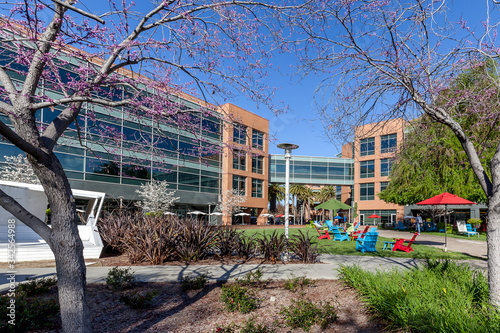 Mountain View, California, USA - March 30, 2018: chair and Building at Google headquarters in Silicon Valley . Google is an American technology company in Internet-related services and products.