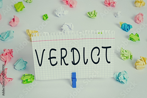 Text sign showing Verdict. Business photo text a decision on an issue of fact in a civil or criminal case Colored crumpled papers empty reminder white floor background clothespin © Artur