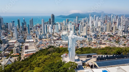 Panoramic aerial view of the Cristo Luz statue and buildings in the city of Balneário Camboriú – Santa Catarina - Brazil