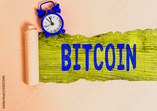 Writing note showing Bitcoin. Business concept for Cryptocurrency Blockchain Digital currency Tradeable token photo