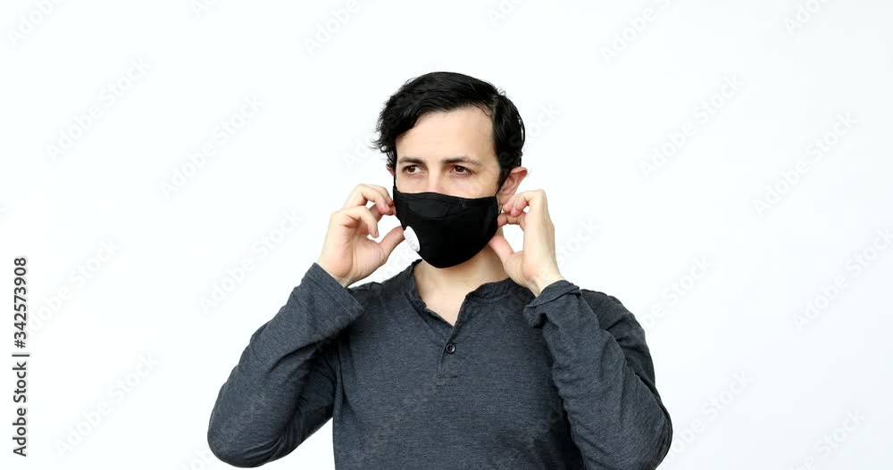 putting on and wearing PPE masks during covid19 virus pandemic putting on and wearing PPE masks during covid19 virus pandemic