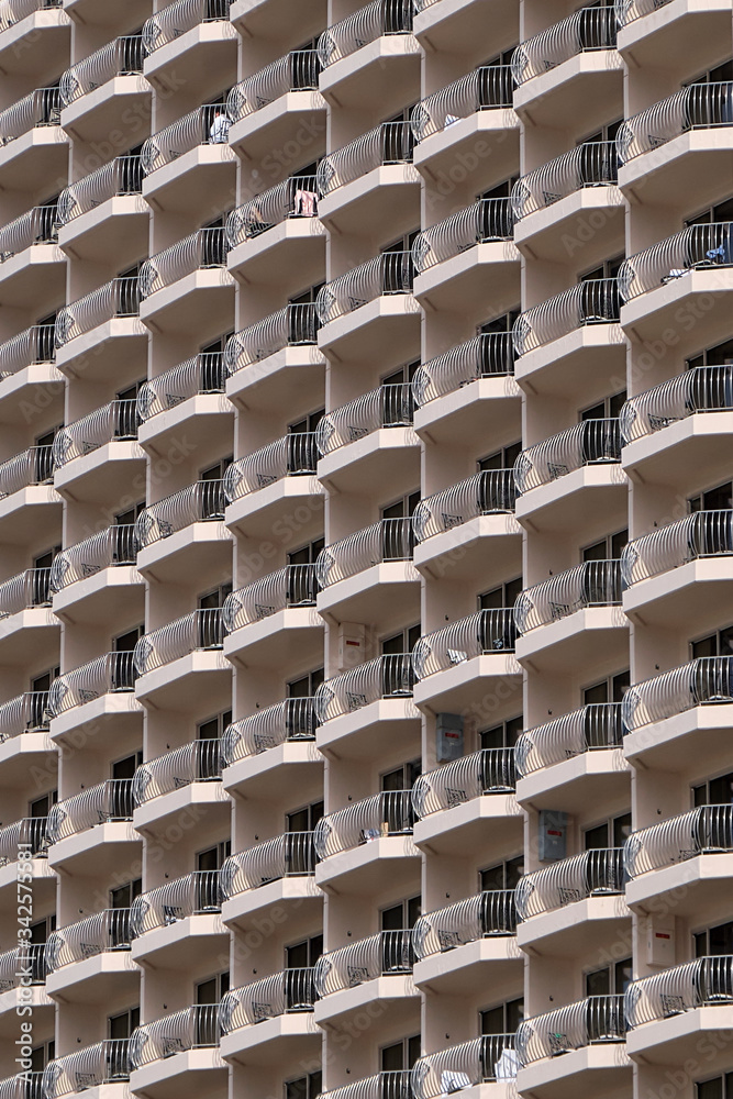 A closeup detail shot of patterns created from balconies on urban residential buildings. A closeup detail shot of patterns created from balconies on urban residential buildings.