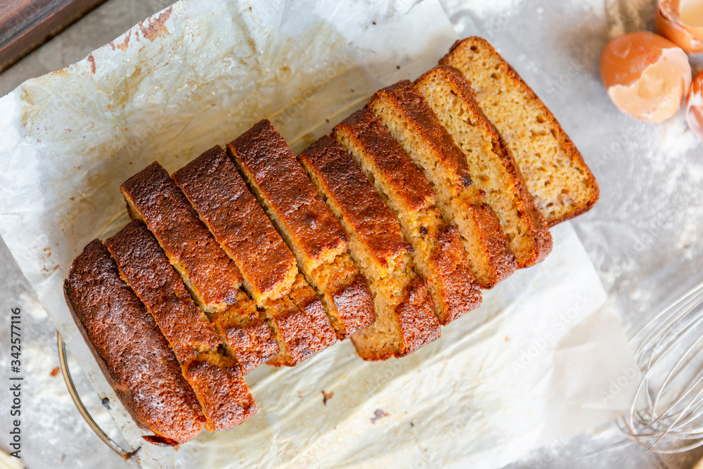 Banana Bread with Ingredients on Grey Background