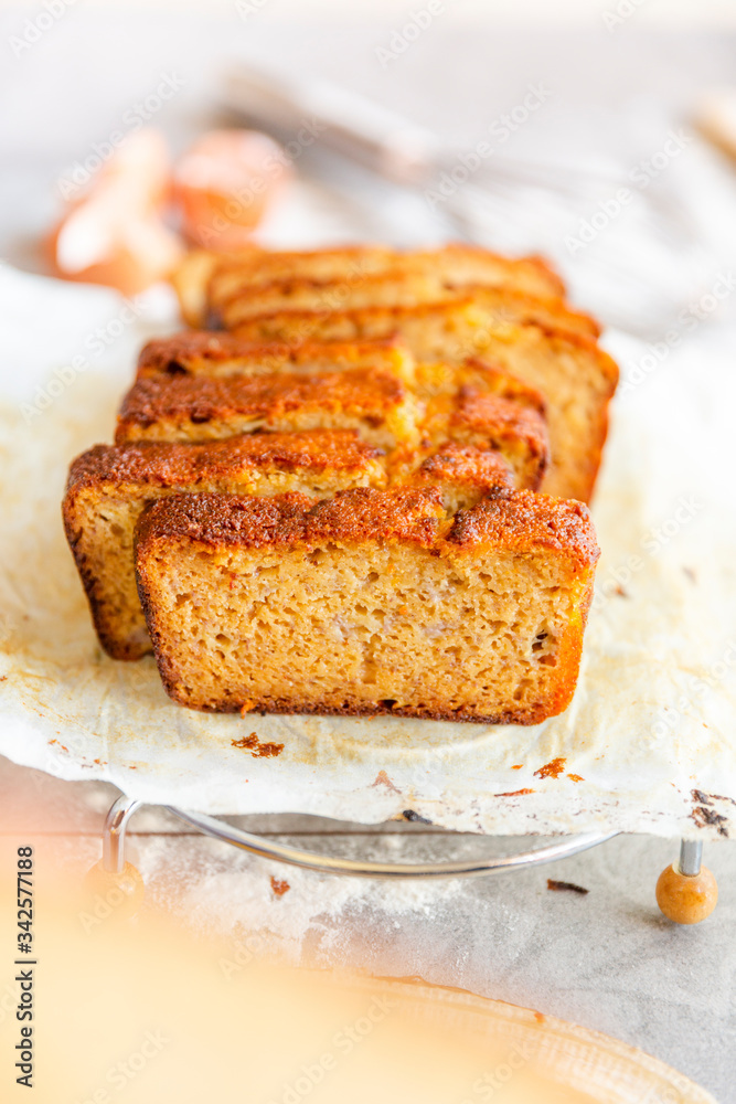 Banana Bread with Ingredients on Grey Background