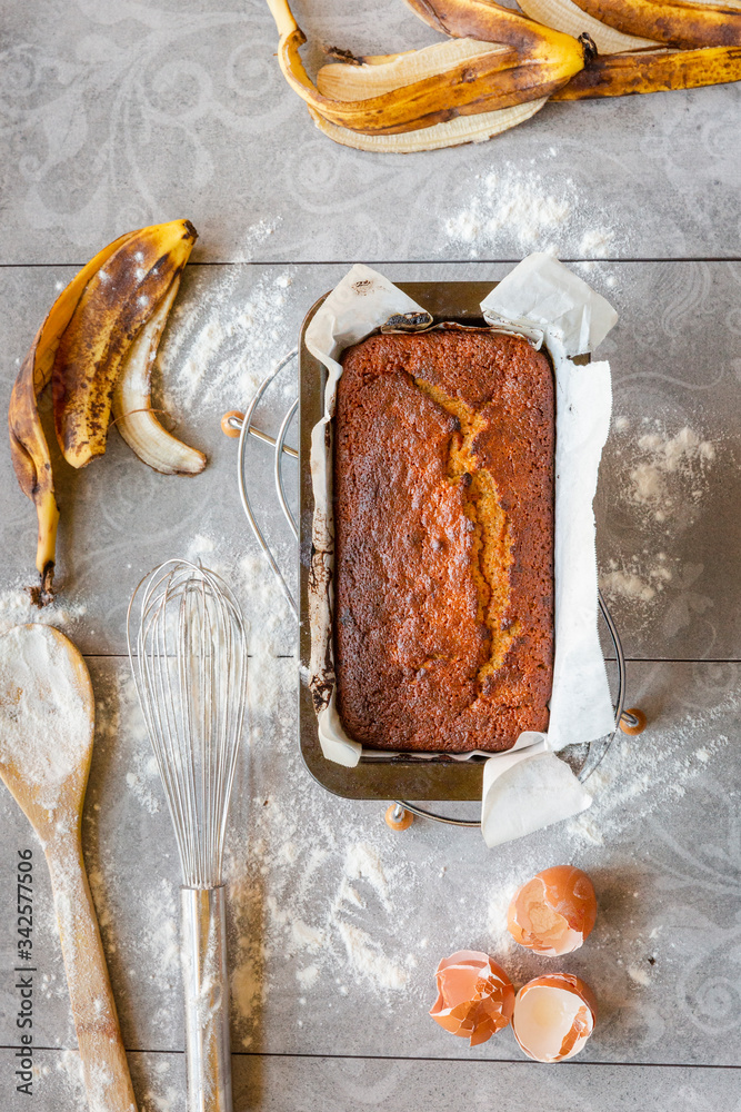 Banana Bread with Ingredients on Grey Background