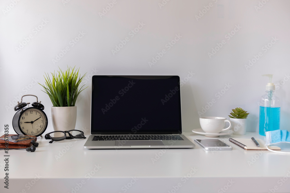 Business of white top table, work from home concept, workspace with laptop and smartphone, credit card shopping online concept to prevent epidemic