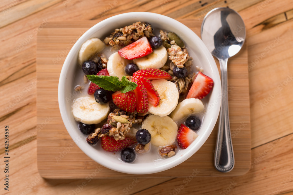 Granola with fresh strawberries, blueberries, and bananas Granola with fresh strawberries, blueberries, and bananas