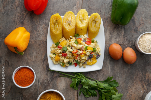 African dishes healthy lifestyle dish with plantain rice and Jollof Rice. Jolof Meal. Egg and plantain. Jelly fish dish with Healthy salad. photo