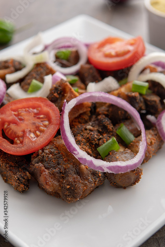 African national dish. Nigerian meal. Healthy lifestyle dish with red onions tomatoes. Salad dish.  photo