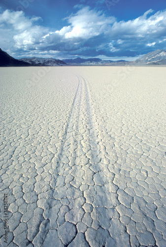 Sliding rock track on Racetrack dried lakebed in Death Valley