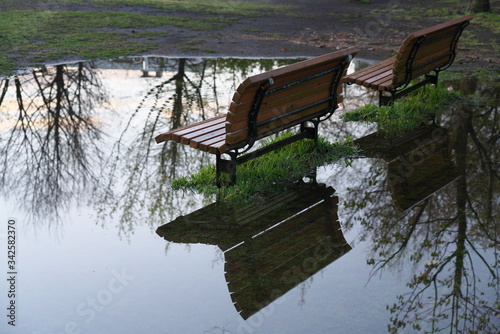 Tokyo,Japan-April 15, 2020: Benches in a puddle after the heavy rain in the morning in Tokyo, Japan
