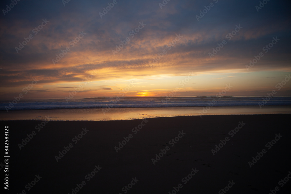 Sunrise view of beach against cloudy sky in Portugal