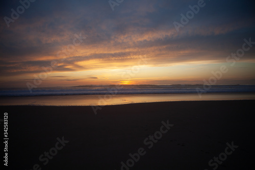 Sunrise view of beach against cloudy sky in Portugal