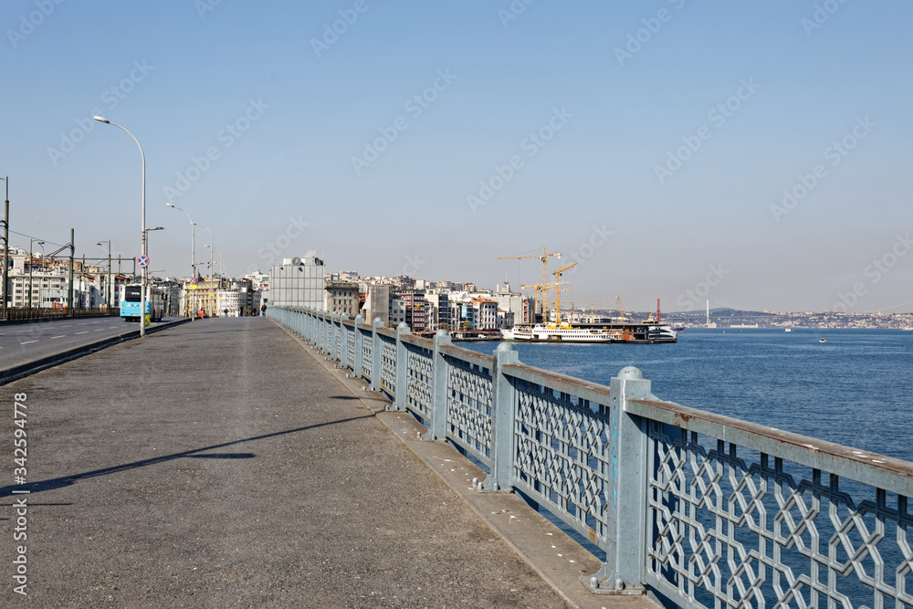 Empty Galata Bridge during Coronavirus pandemic restrictions and lockdown measures which is normally full of road fishers.