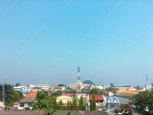 Prachuabkirikhan city in the morning light with many of local building rooftop and moutain behind. January 20, 2019 photo