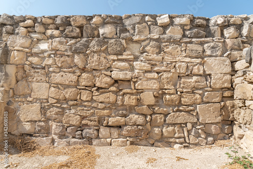 Wall of the medieval castle of Kolossi with soil and a piece of blue sky  Cyprus .