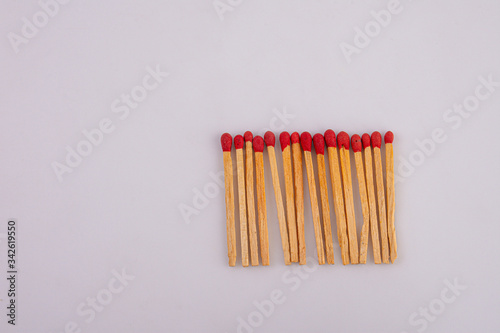 Matches lined up on White background.