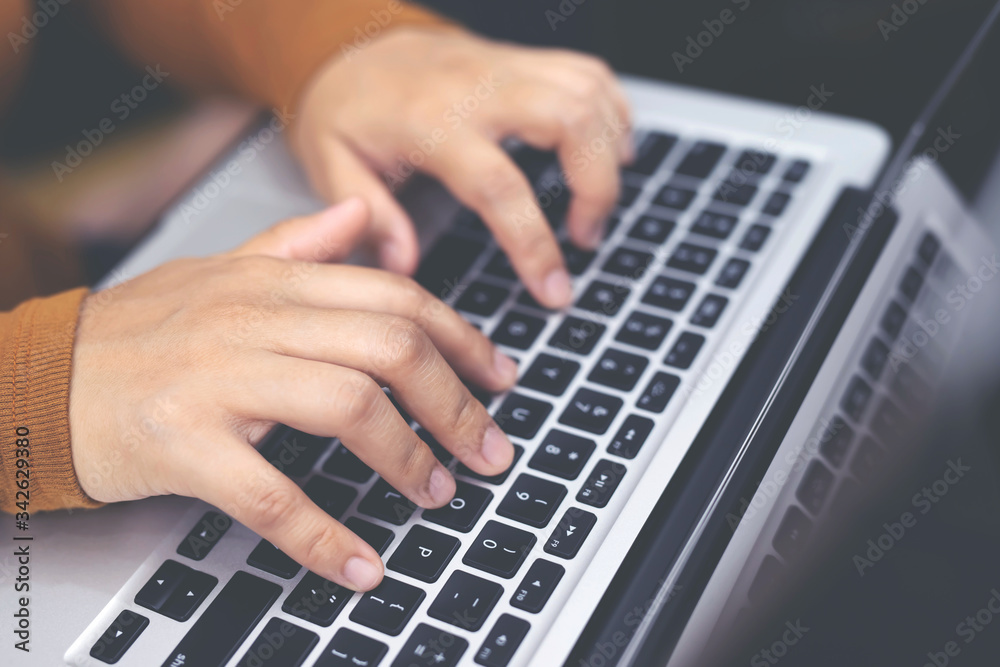 laptop. lifestyle woman close up hand keyboard sit on sofa using a notebook computer to work from home and search information social network online. laptop. lifestyle woman close up hand keyboard sit on sofa using a notebook computer to work from home and search information social network online.