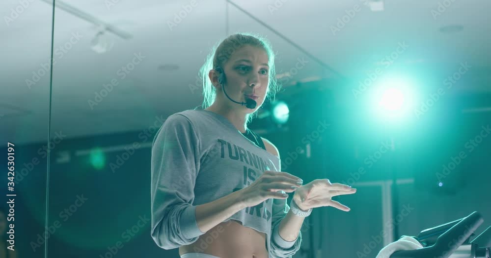 Spin class instructor teaching class