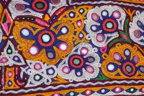 Handmade tribal skirt with embroidery and mirror work selective focus embroidery seen in India and Pakistan pattern arts close up