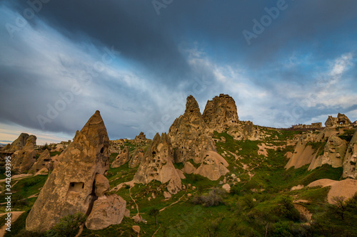 Beautiful sandstone rock formations in Cappadocia  Turkey  under stormy  cloudy  sky