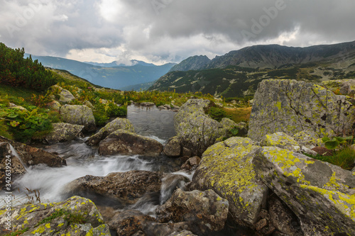 Stormy landscape with granite rocks and glacier lakes in the Transylvanian Alps