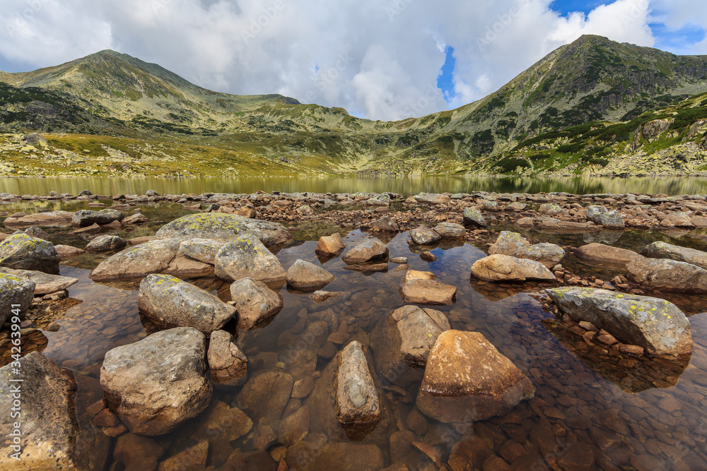Summer scenery and glacier landscape in the Alps, with beautiful cumulus clouds Summer scenery and glacier landscape in the Alps, with beautiful cumulus clouds