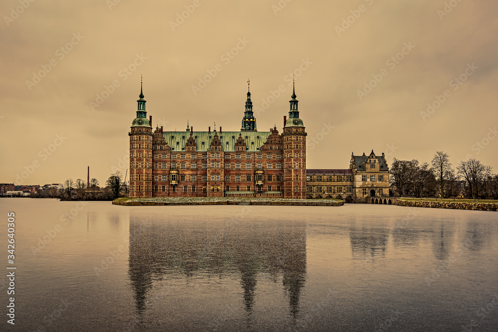 Naklejka premium Reflections in the thin ice of the lake at Frederiksborg Castle