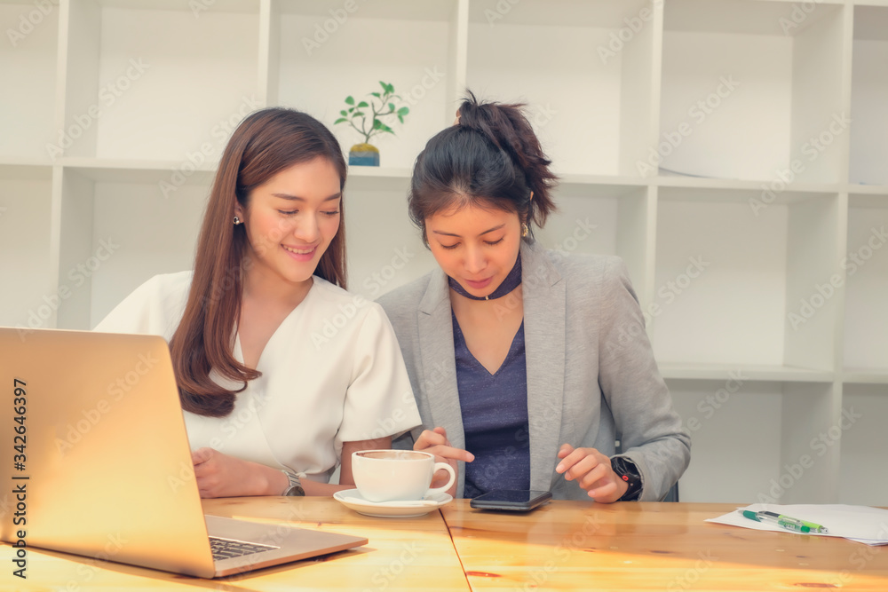 Asian business woman working in co-working space, online meeting, working in small team and brainstorming Asian business woman working in co-working space, online meeting, working in small team and brainstorming