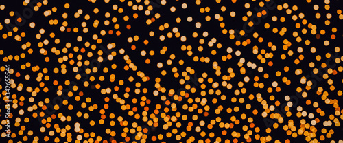 Background of Golden  yellow and red lights bokeh background on black sky.