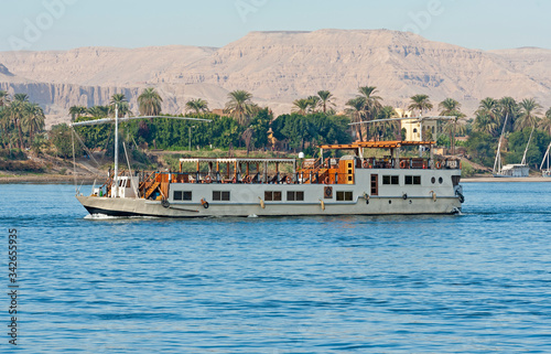 Large egyptian river cruise dahabeya boat sailing on Nile