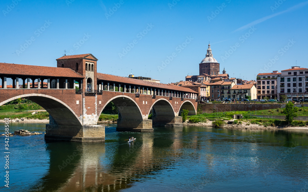 Historical covered bridge over the Ticino River in Pavia City in Italy Pavia, Province og Pavia, northern Italy, june 28,2015