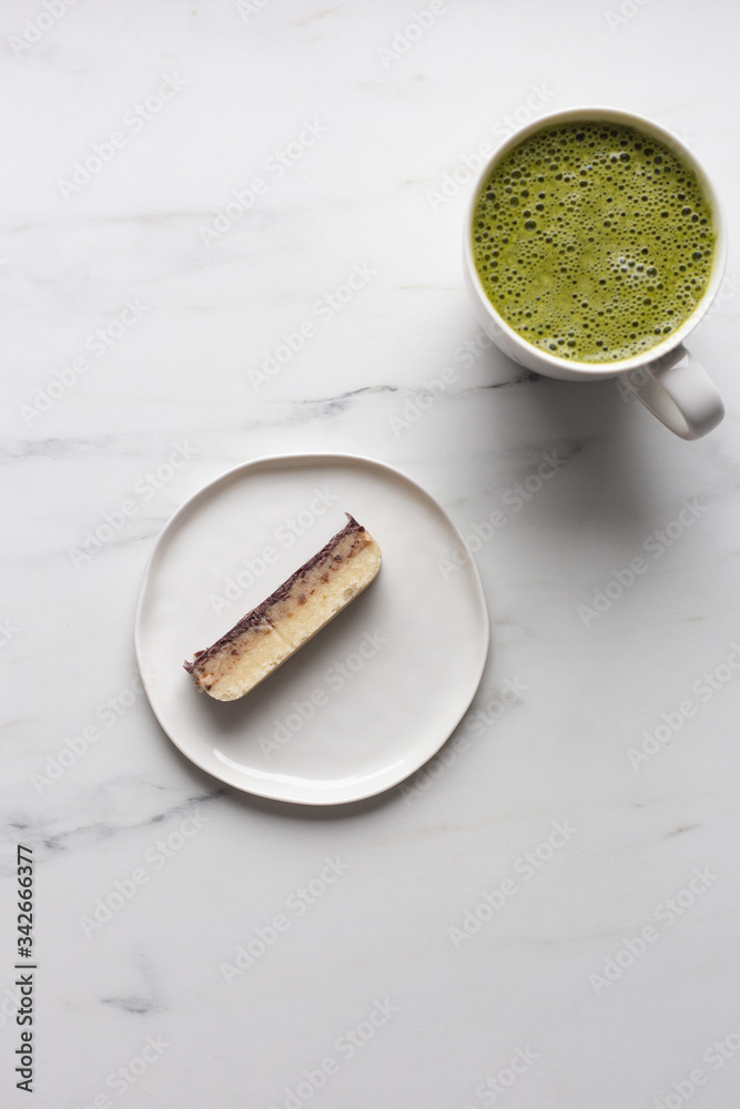 Matcha green tea latte with vegan sugar free cake Matcha green tea latte with vegan sugar free cake