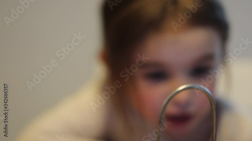 Covid-19 Coronavirus and Learning from home. Little girl online learning and creating at home. Quarantine and Social distancing concept.