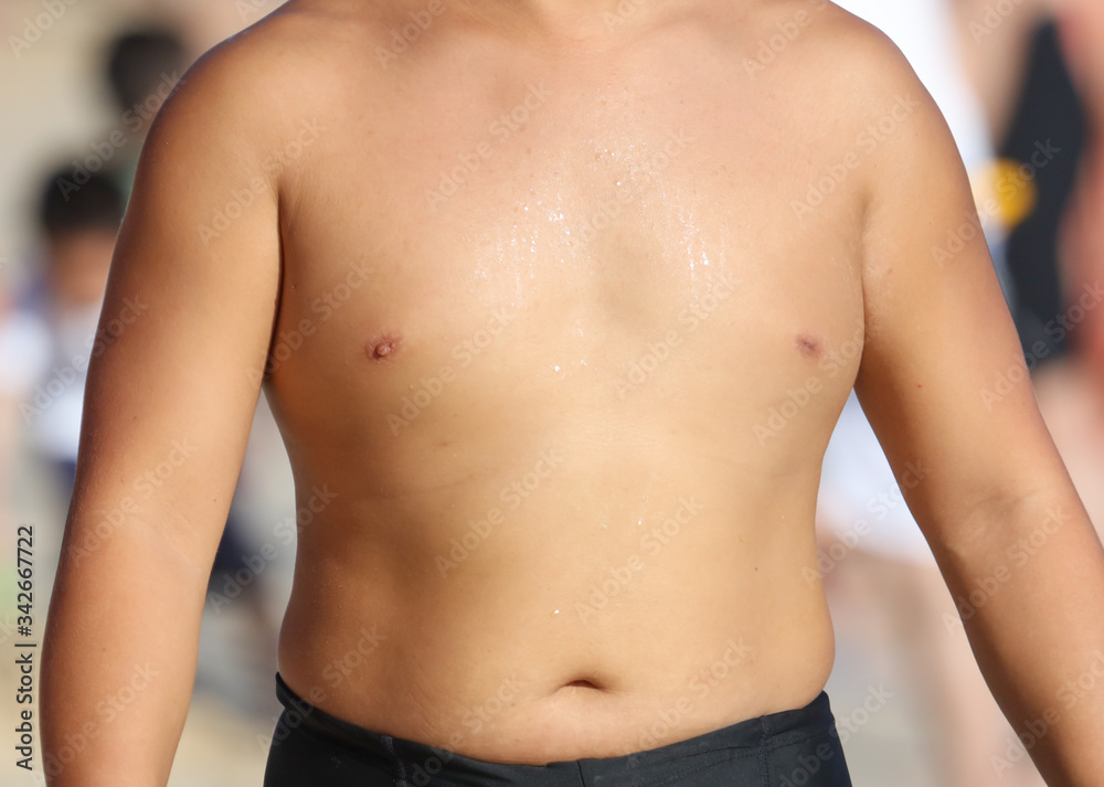 The bare chest of an Asian man