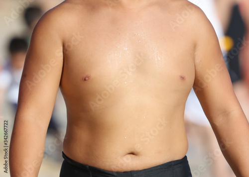 The bare chest of an Asian man