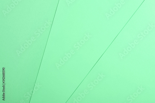 Paper sheets as background. Image toned in mint color