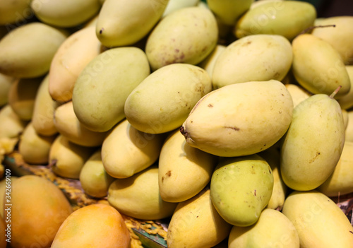 Mango on the counter in the market .