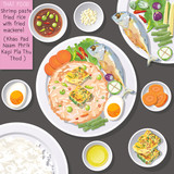 Top view of Thai food, shrimp paste fried rice with fried mackerel (Khao Pad Naam Phrik Kapi Pla Thu Thod).

