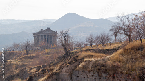 Mountain landscape in Armenia cloudy day.Caucasian Mountains. A beautiful column of the Temple of Garni.