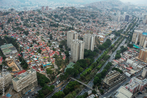 Vista aérea de la autopista Valle-Coche y los barrios populares de San Agustín en Caracas, Venezuela photo