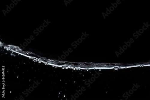 Surface fresh water splash with air bubble in abstract background and black and white tone