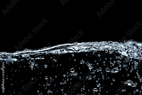 Surface fresh water splash with air bubble in abstract background and black and white tone